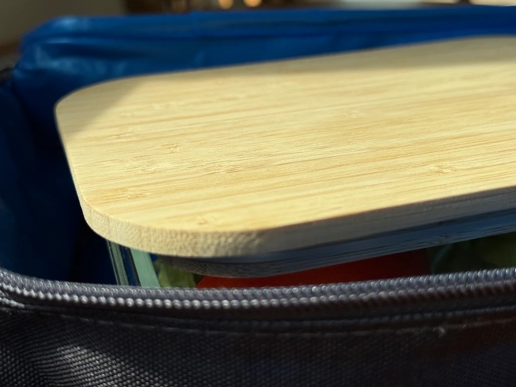 PackIt lunch box open with container inside, zipper closeup
